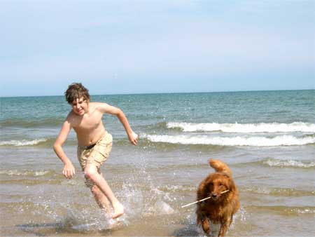 dog and boy running